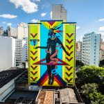 Mural em grafite, feito pela artista Criola, representa simbologias da cultura afro-brasileira